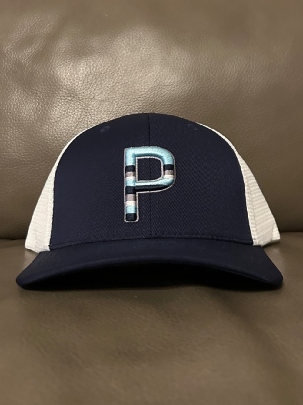 Puma Golf Navy/White Sundown P Flexfit 110 Trucker Snapback Hat